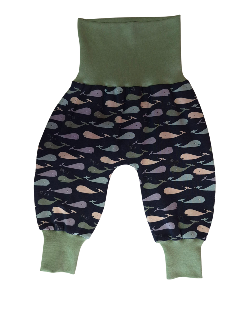 Baby Trousers with whale pattern and green trim on a white background