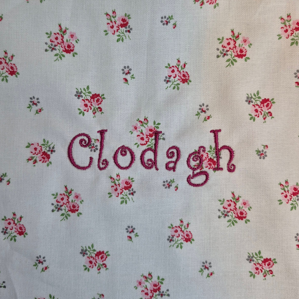 Scalloped  Floral  Bib
